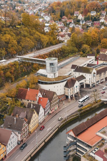 Aerial view of a city with colorful autumn leaves, river and central tower building, Hermann