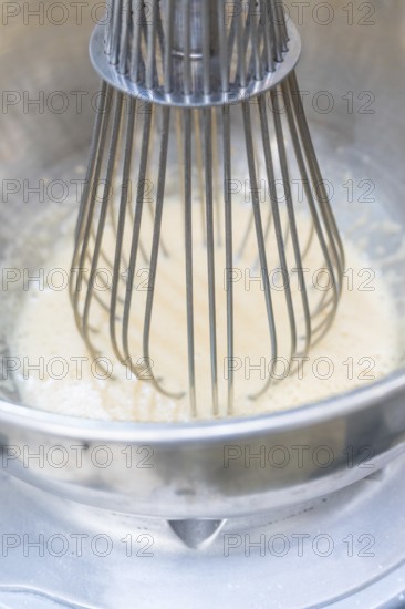 A metal whisk mixes a white mass in a metal bowl, Christmas baking, Haselstaller Hof, Wildberg,
