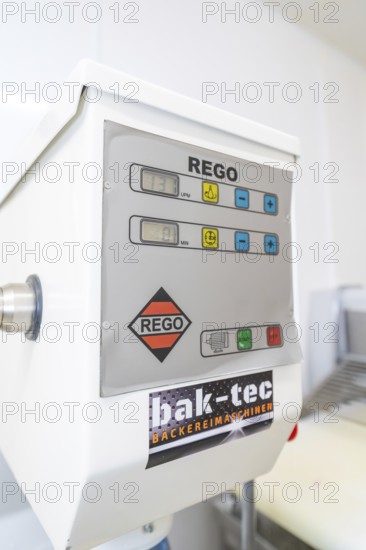 Close-up of a rego bakery machine with various control buttons in a bakery, Weihnachtsbacken,
