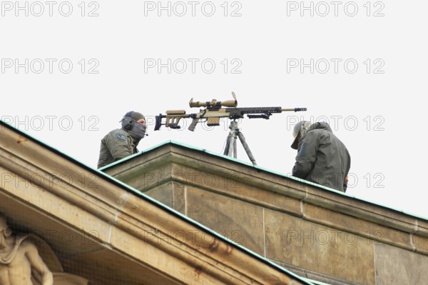 Police scope shooter on the roof of the new guard. - Memorial Day Wreath laying for victims of war