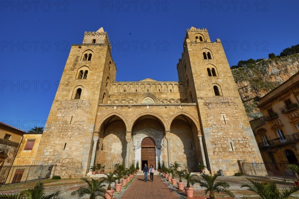 Impressive cathedral with main façade and symmetrical towers in clear skies, historic atmosphere,
