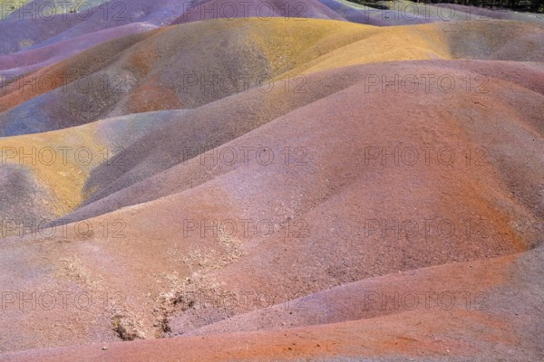 Rolling hills of colored sand form a unique landscape in rainbow colors. Africa, East Africa,