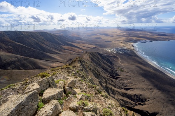 Castillejo viewpoint, view from the Risco de Famara cliffs to the coast and the sea with the Famara