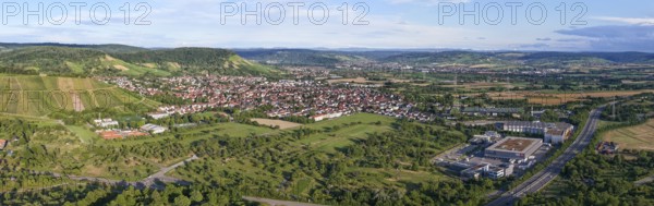 Panoramic view of an urban area with vast hills and blue skies, Korb im Remstal municipality,