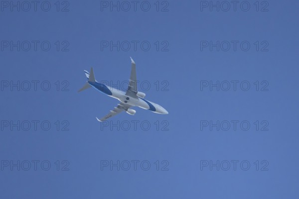 Boeing 737 jet passenger aircraft of El Al Israel airlines flying in a blue sky, England, United
