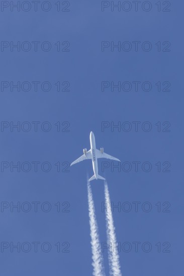 Boeing 787-9 Dreamliner jet passenger aircraft of Gulf Air airlines flying in a blue sky with