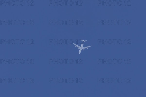 Airbus A340 jet passenger aircraft of Lufthansa airlines flying in a blue sky, England, United