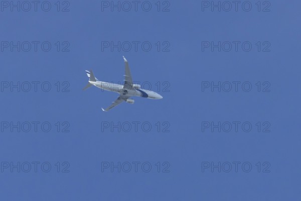 Boeing 737 jet passenger aircraft of El Al Israel airlines flying in a blue sky, England, United