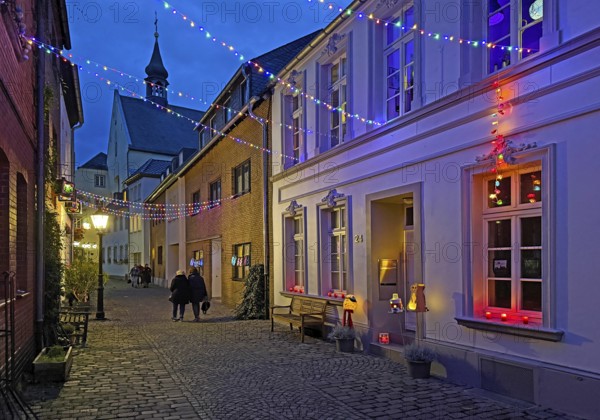 Tastefully decorated Tiefstraße in the evening with St. Peter's Church, Kempen, Lower Rhine, North