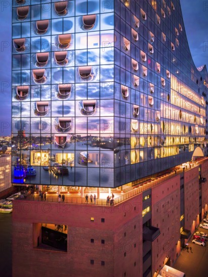 Aerial view of the Elbe Philharmonic Hall with reflections on the façade in the evening light above