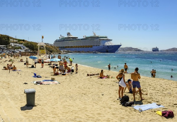 Mykonos, Cyclades, Greece - Voyager of the Seas cruise ship is located in Mykonos Harbour Bay. In
