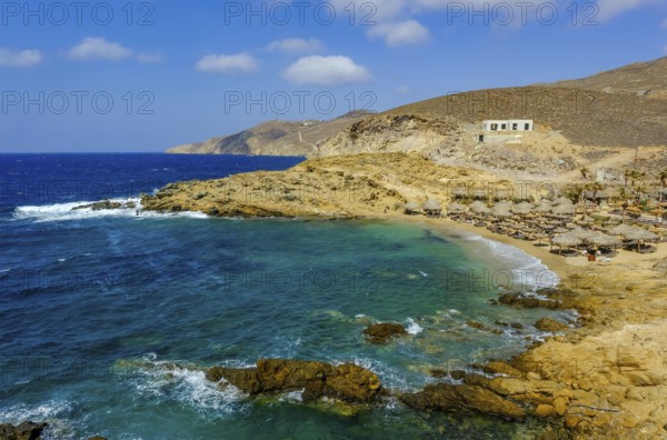Mykonos, Cyclades, Greece - Ftelia Beach, Ftelia Beach, sandy beach on a windy rocky coast in the