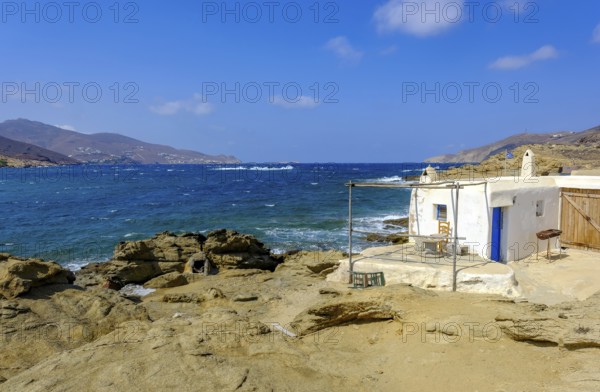 Mykonos, Cyclades, Greece - Ftelia Beach, fishing lodge on Ftelia beach, sandy beach on windy rocky