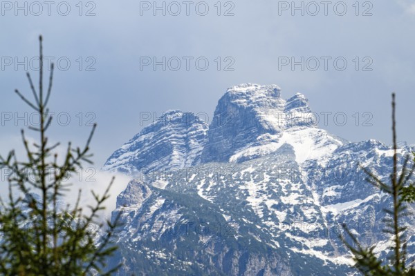 View into the mountains next to Lake Almsee on a rainy day in spring, Traunstein summit,