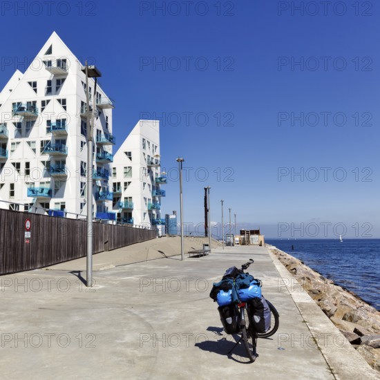 E-bike with luggage bags, bike tour, pyramid-shaped buildings, sunny summer weather, Isbjerget