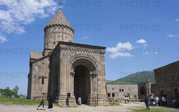 Historic monastery with medieval architecture and impressive tower in scenic surroundings under