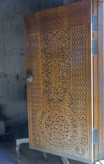 Detailed wooden door with cross engraving and ornaments, Tatev monastery, Tatev, Armenian Apostolic