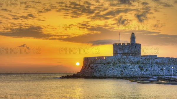 Agios Nikolaos fortress, glowing sunrise behind a castle by the sea, conveys peace, UNESCO World