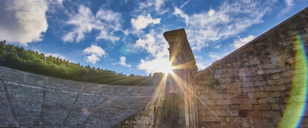 Rays of sun over ancient ruins, with a dramatic sky full of clouds, UNESCO World Heritage Site,