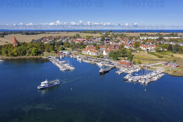 Aerial view over sailing boats in the harbour, marina of the village Kirchdorf in the Bay of