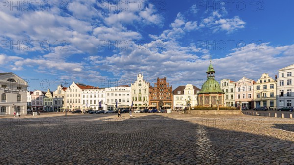 Wismar water art and restaurants on the market square in the old town, Hanseatic City of Wismar,