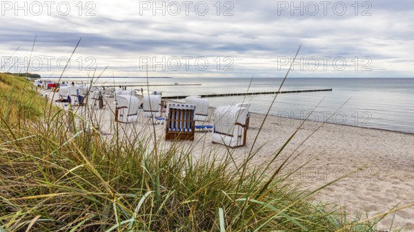 Beach with beach chairs on Schwarzen bush on the island of Poel on the Baltic Sea,
