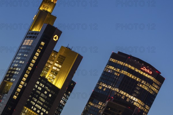 The towers of Commerzbank and Deka Bank in Frankfurt am Main light up in the evening, Frankfurt am