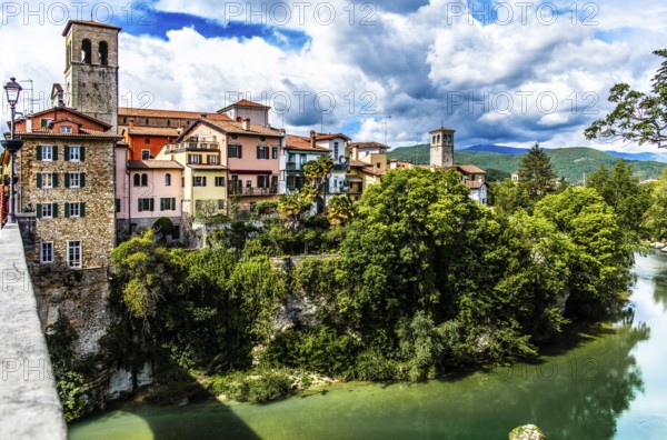 Ponte del Diavolo from the 15th century leads across the Natisone river to the old town, Devil's