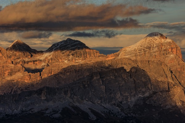 Steep mountains, mountain range, sunset, cloudy, autumn, Pordoi Pass, view of Tofana Group,