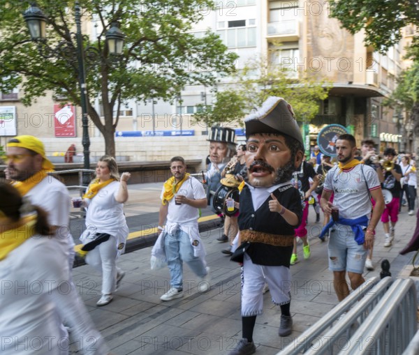 Evening procession through city streets by youth group organisation, Pilar 2025 festival event,
