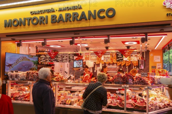 Market stall shop store selling butcher meat products inside Mercado Central de Zaragoza, Zaragoza,