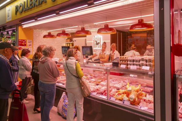 Market stall shop store selling chicken meat products inside Mercado Central de Zaragoza, Zaragoza,