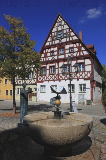 Half-timbered houses and fountains on Rathausplatz, city of Heideck in the district of Roth, Middle