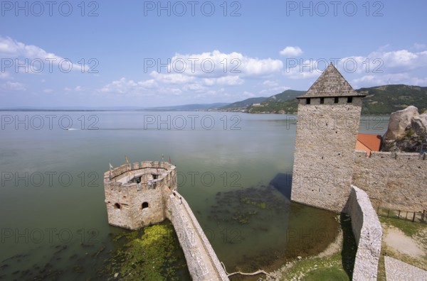 Golubac Fortress or Kolumbatz or Pigeon Town or Pigeon Castle on the Danube, in the background the