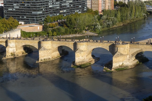 View looking down of historic Stone Bridge, Puente de Piedra, spanning the River Ebro, Zaragoza,