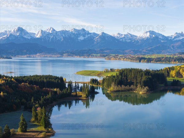 Natural scenery with snow-covered mountains, a lake and autumn leaves, Illasbergsee, Forggensee,