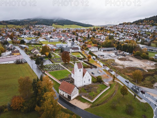 Small town with a central church, nestled in an autumn-colored area, Wehingen, Tuttlingen district,
