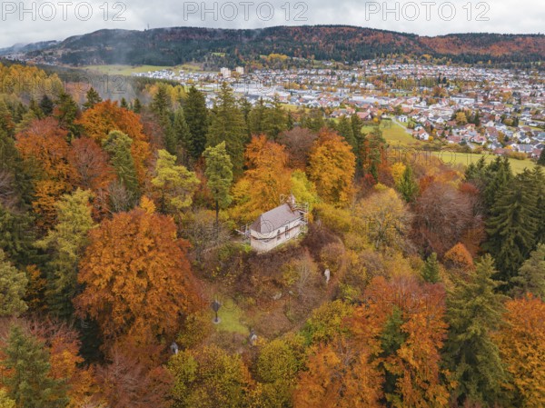 Small platform above a colorful autumn forest, the village in the background, Wehingen, Tuttlingen