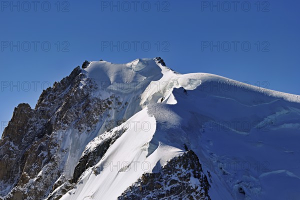 View of the snow-covered Mont Blanc du Tacul from the Aiguille du Midi, Chamonix-Mont-Blanc,