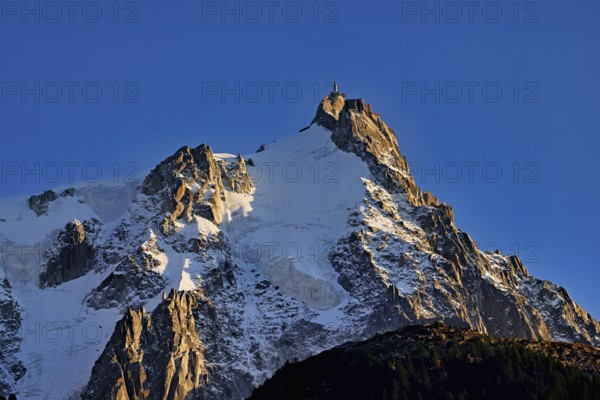 Snowy Aiguille du Midi in the evening light, Mont-Blanc, Chamonix-Mont-Blanc, Haute-Savoie, France