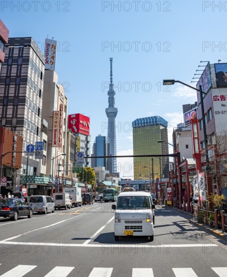 Street with typical Japanese houses, Sumida City skyline in the back, Sumida City Office, Tokyo