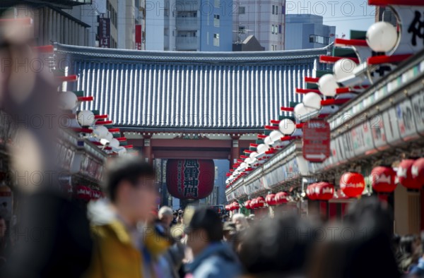 View of numerous visitors on Nakamise-dori shopping street at the Thunder Gate Kaminarimon of