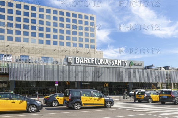 Taxis in street outside Barcelona-Sants railway station building in city centre, Barcelona,