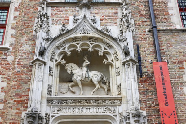 Gruuthusemuseum with equestrian statue of Lodewijk van Gruuthuse above the entrance portal in the