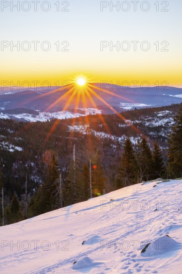 Sunrise over the hills of czech republic from Mount Lusen wth the view over the hills of the