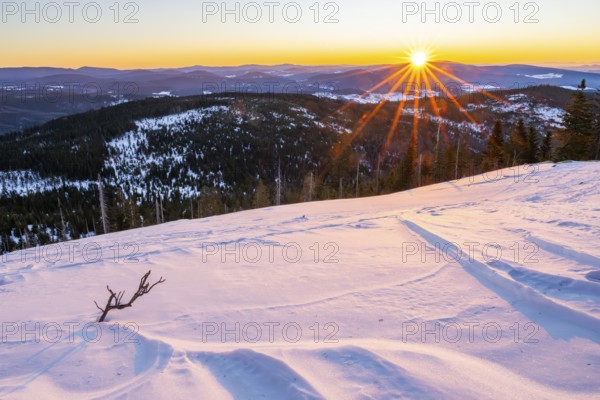 Sunrise over the hills of czech republic from Mount Lusen wth the view over the hills of the
