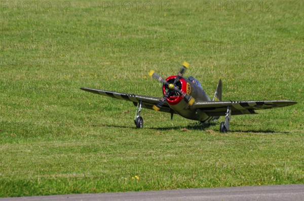 An RC model of a Republic P-47 Thunderbolt during a demonstration as part of an air show at the