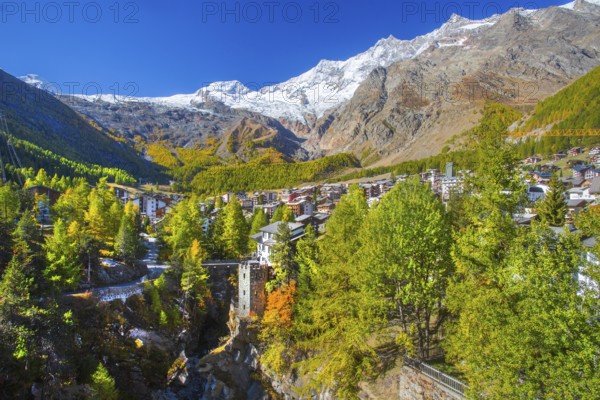 City overview with Allalin 4027 m, Alphubel 420 6 m and Mischabel group 4545 m in autumn, Saas-Fee,