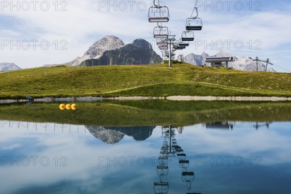 Mountain landscape with reservoir and chairlift, Saloberkopf, Warth, Bregenzerwald, Vorarlberg,