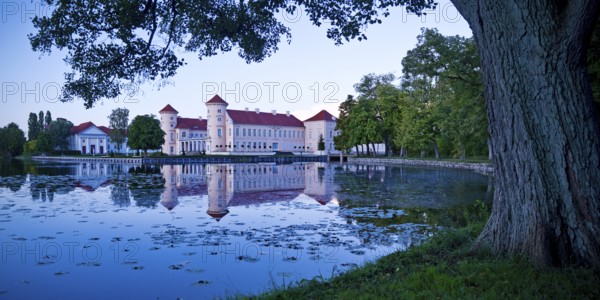 Rheinsberg Castle, lakeside with Lake Grienerick at night, prime example of Friederician Rococo,